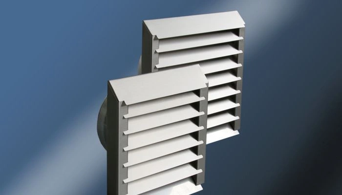 Installation de grilles de ventilation sur double vitrage à Bruxelles — Vitrier Anderlecht